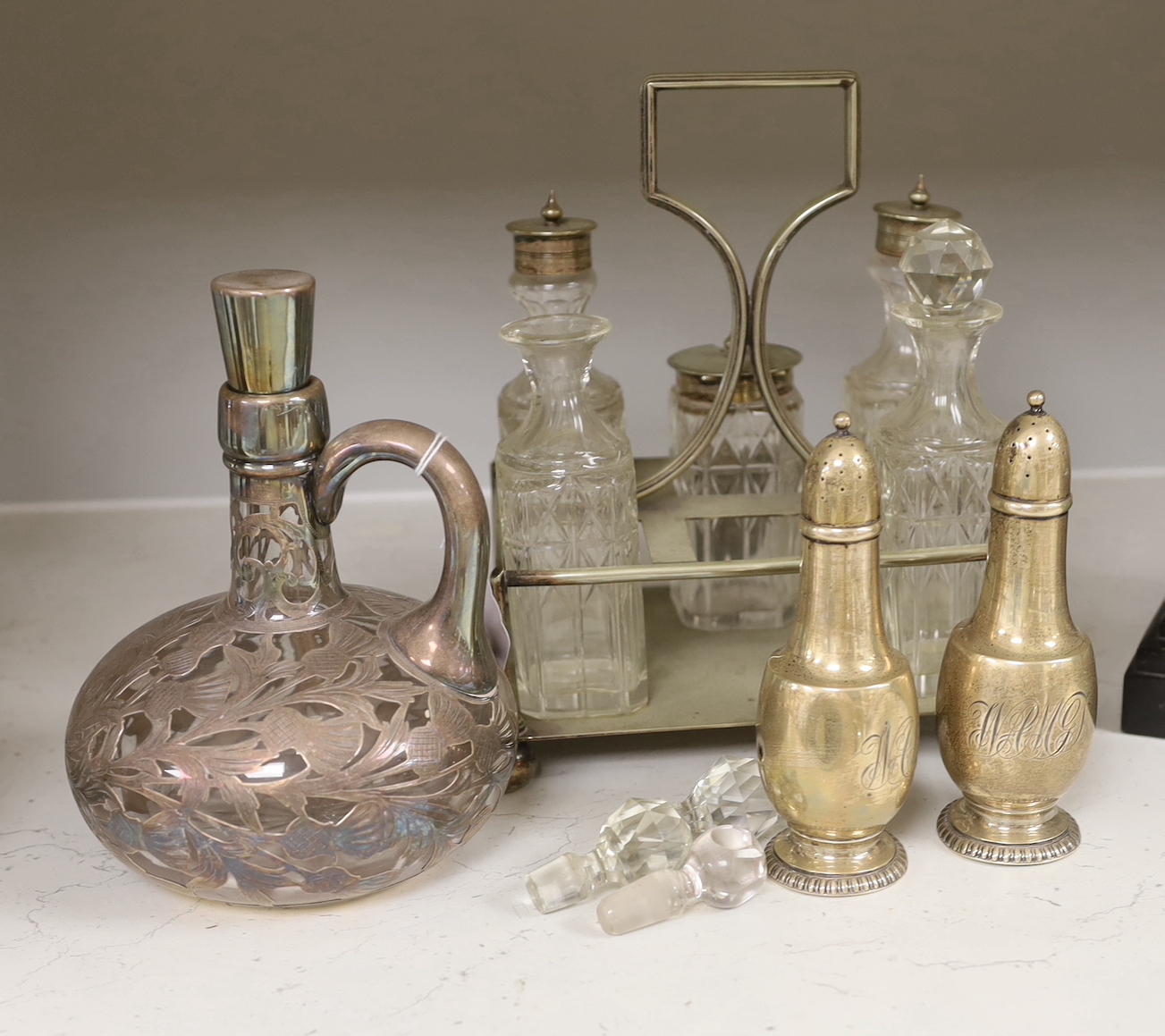 A pair of Tiffany silver peppers, a plated cruet and an overlaid whisky decanter, Tiffany peppers 14.5cm high